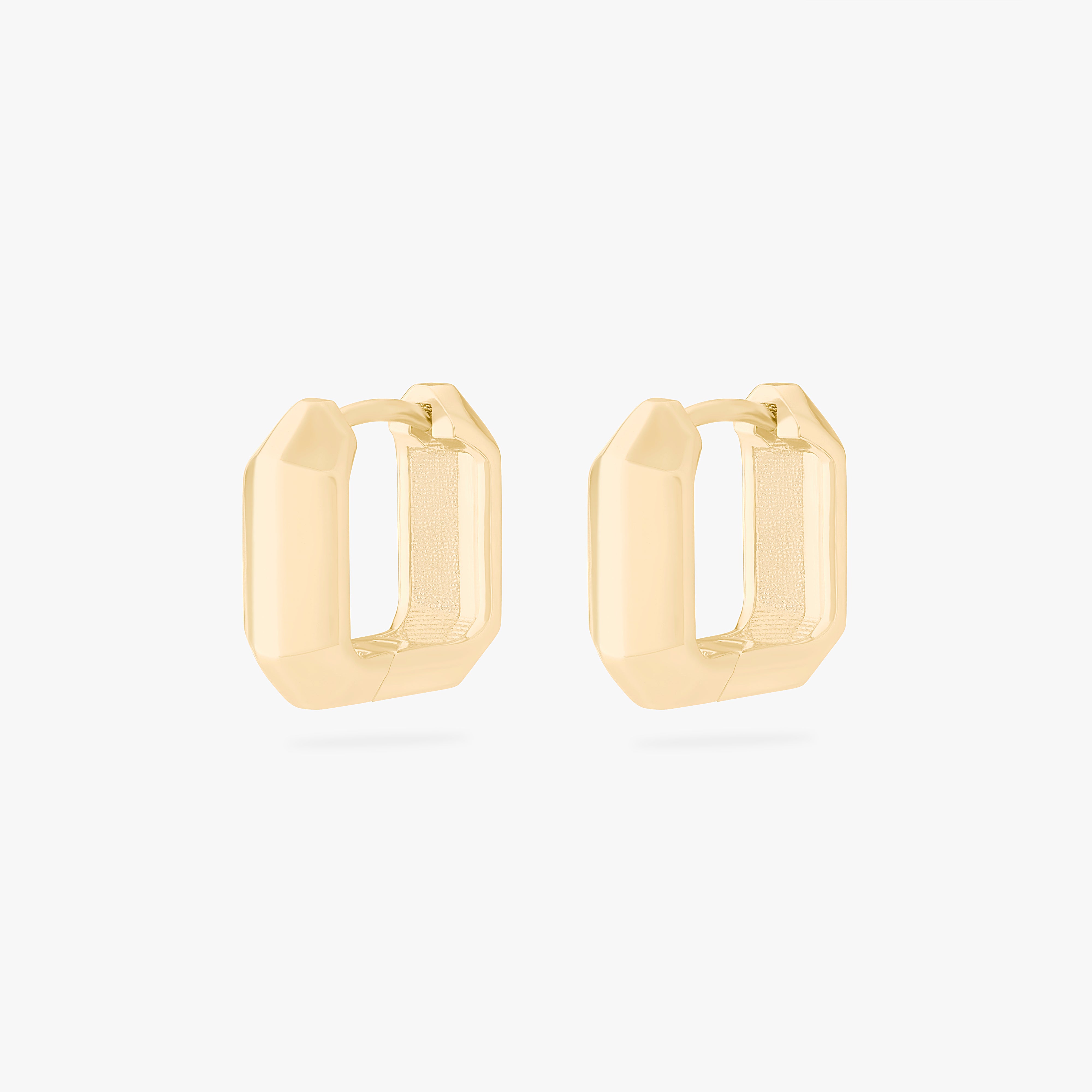 This is an image of a pair of gold toned huggies that are square shaped. [pair] color:null|gold