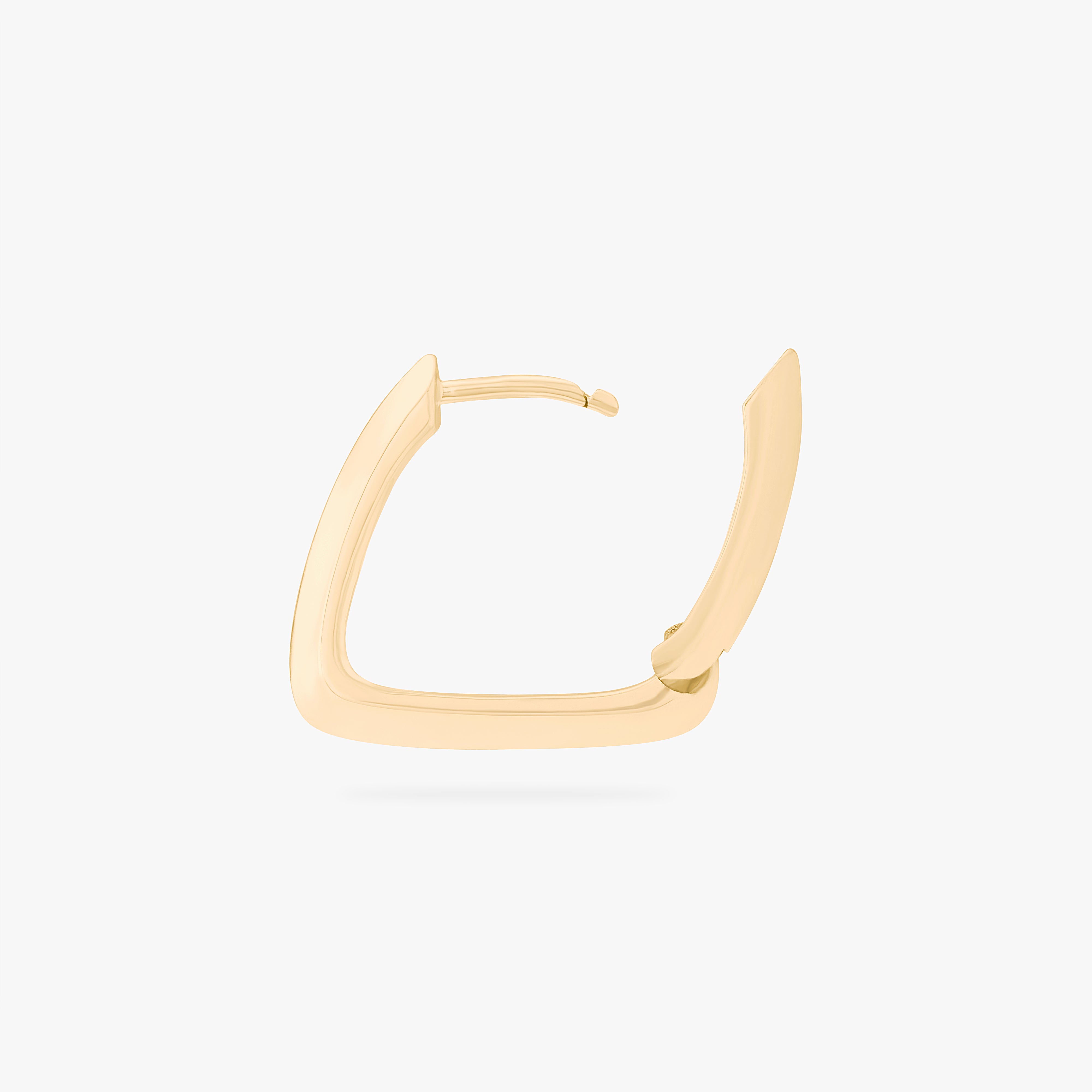 This is an image of a gold toned triangle-shaped hoop. color:null|gold
