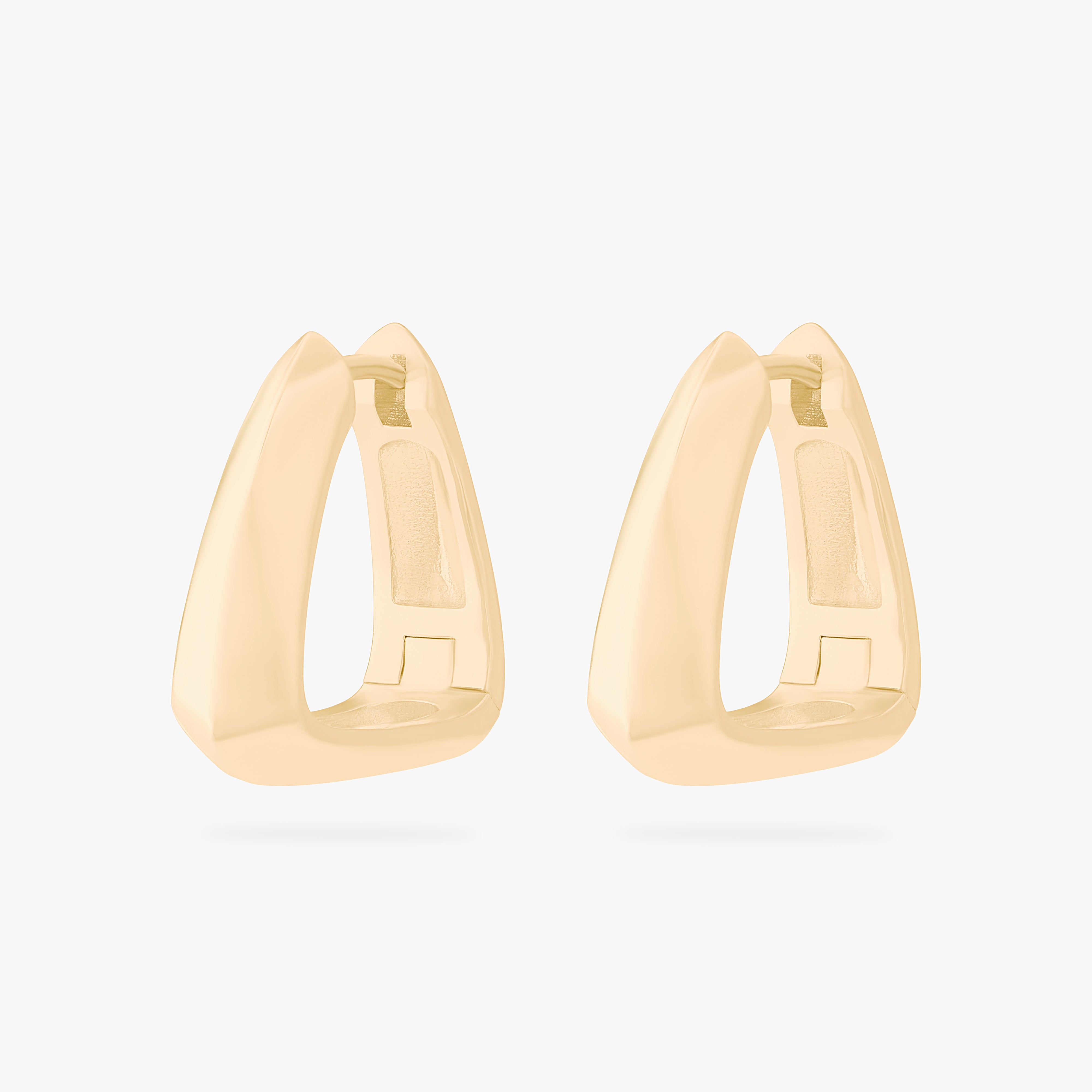 This is an image of a pair of gold toned triangle-shaped hoops. [pair] color:null|gold