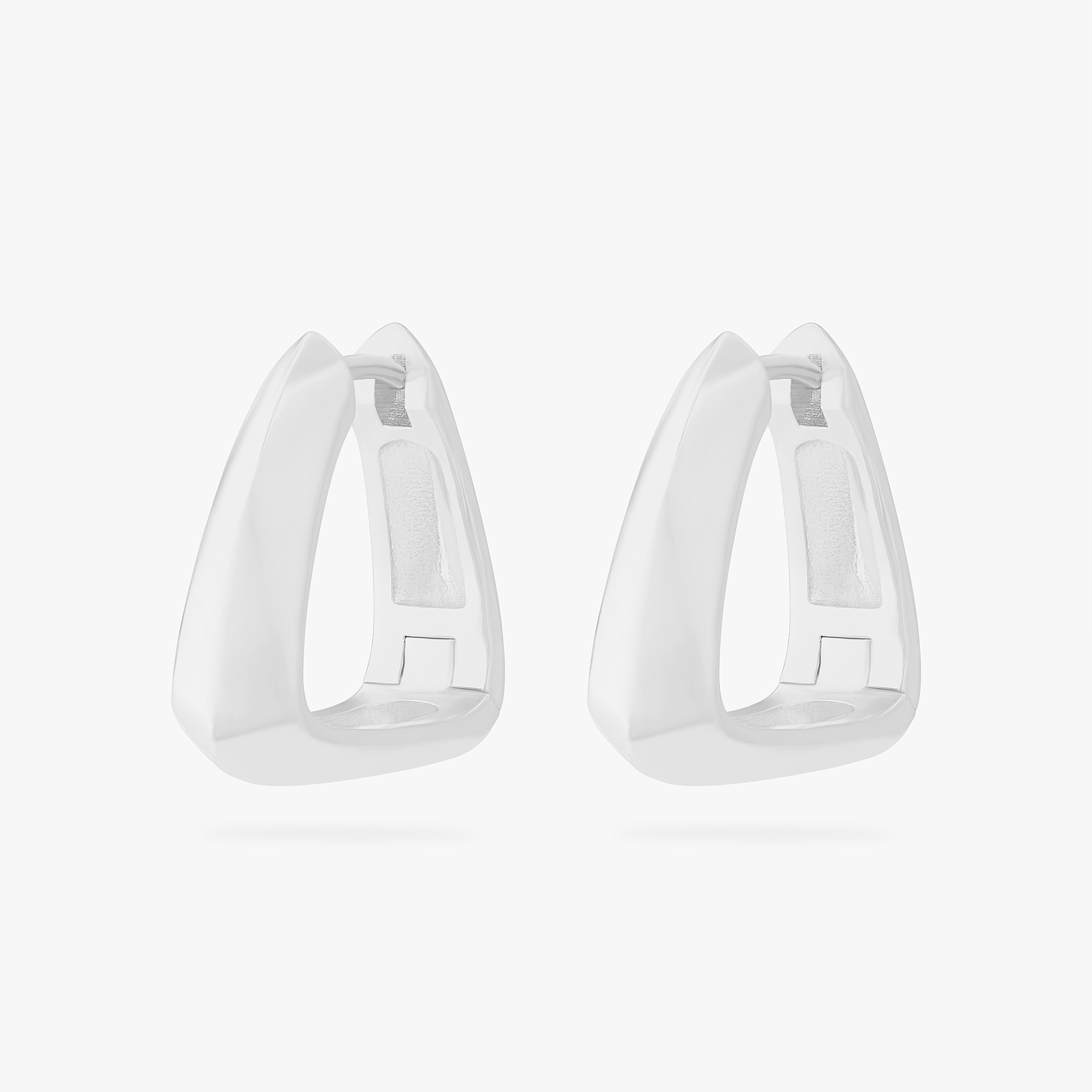 This is an image of a pair of silver toned triangle-shaped hoops. [pair] color:null|silver