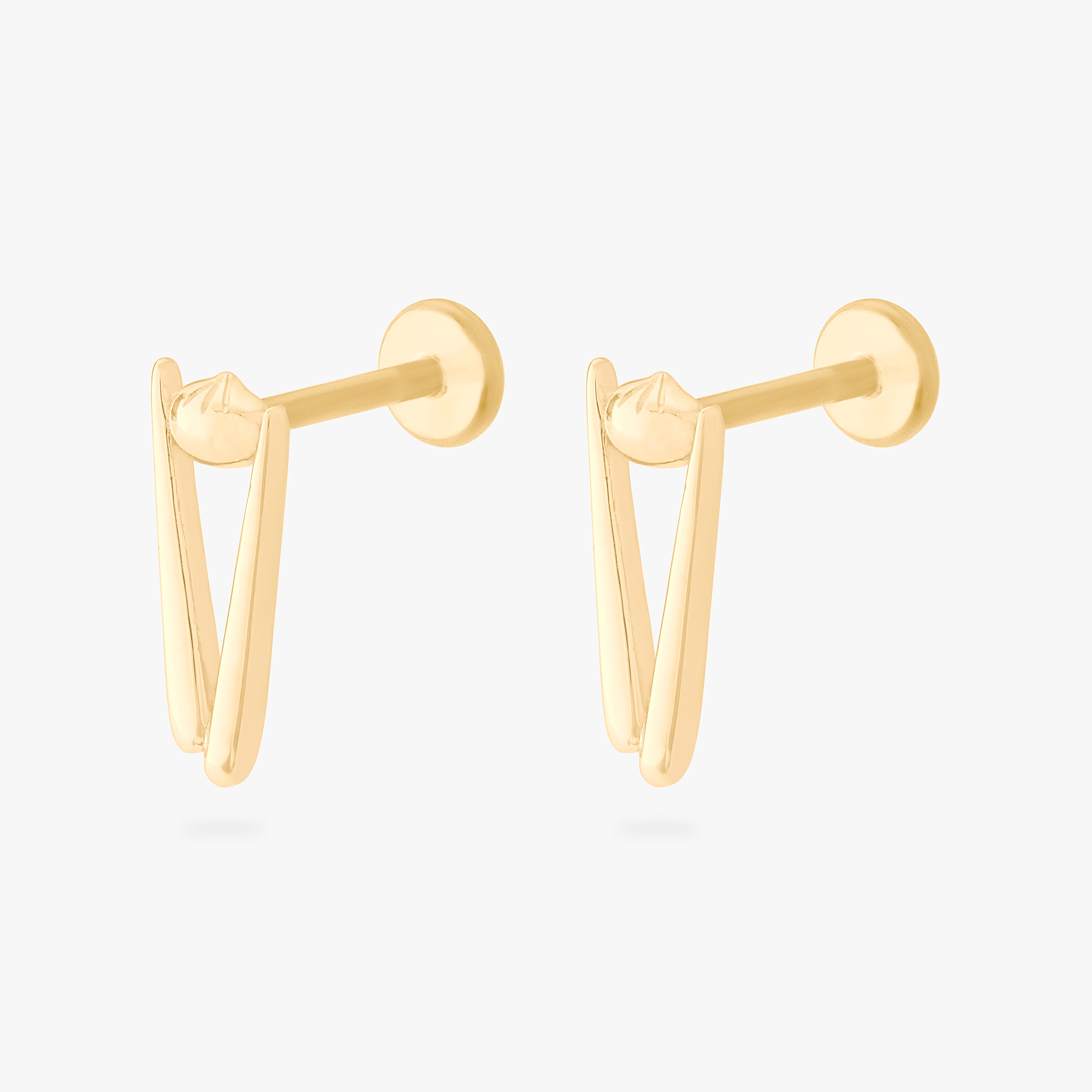 collaboration collection between DTF x Studs featuring a flatback with a pair of chopsticks holding a dumpling in gold color:null|gold