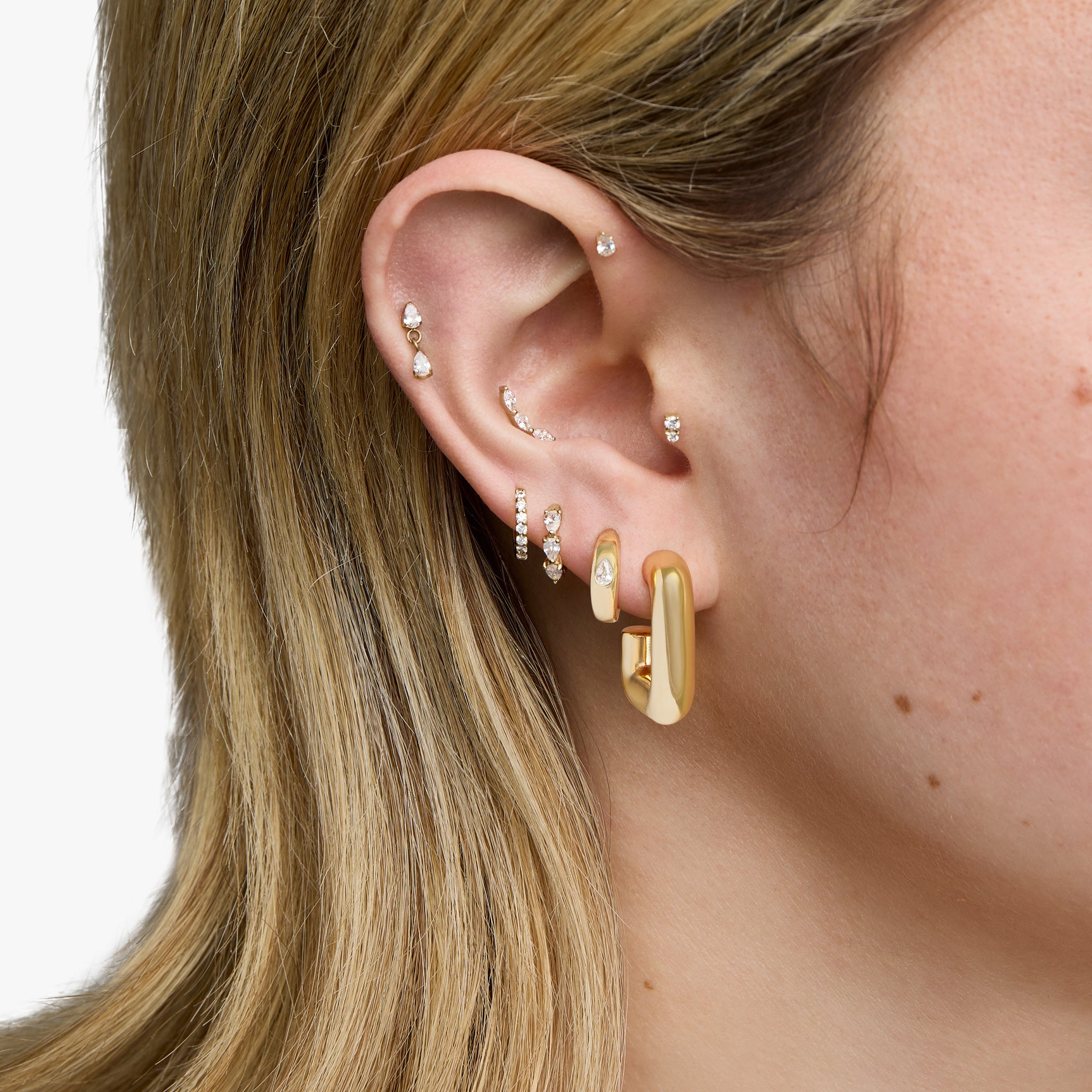 This is an image of a gold toned square hoop with a butterfly back. [hover] color:null|gold