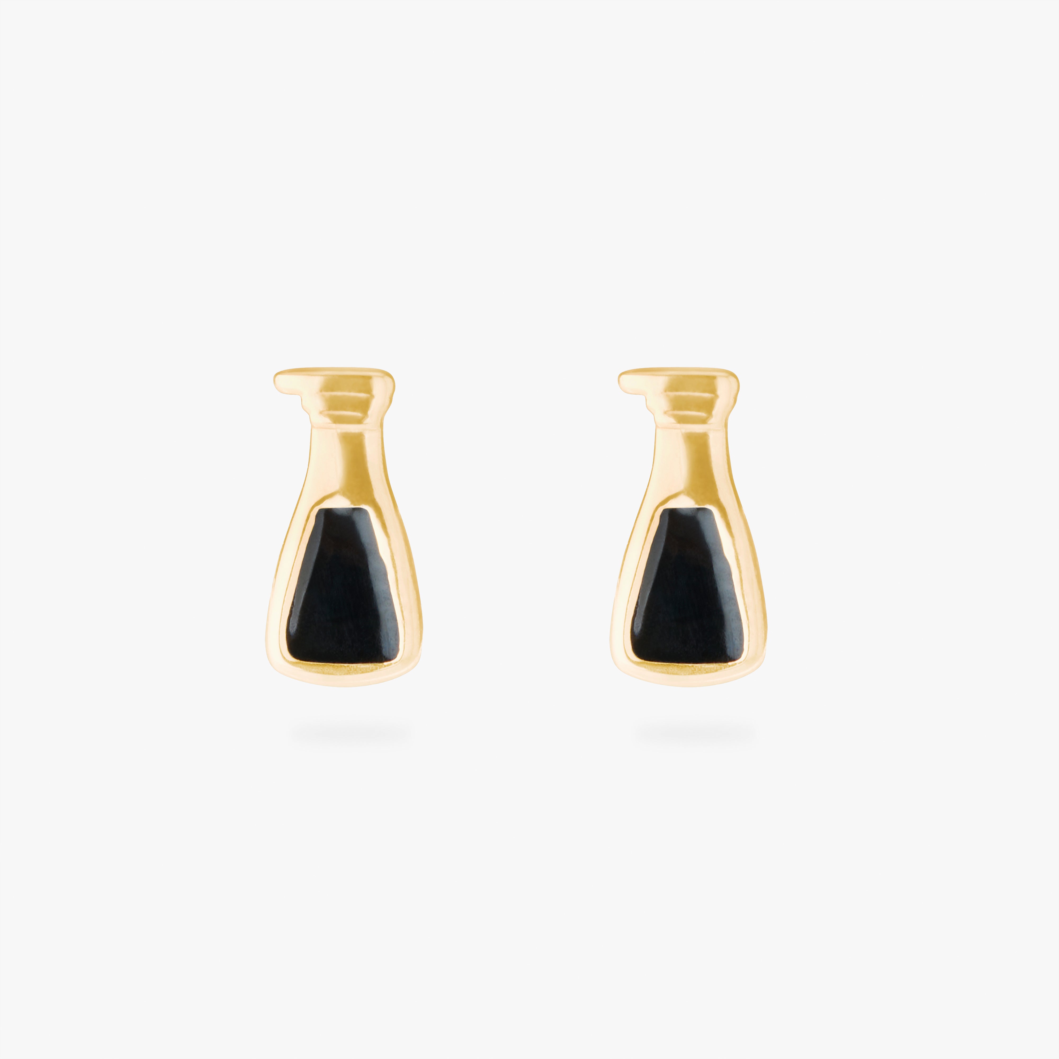 collaboration collection between DTF x Studs featuring a flatback with a bottle of black vinegar in gold color:null|gold
