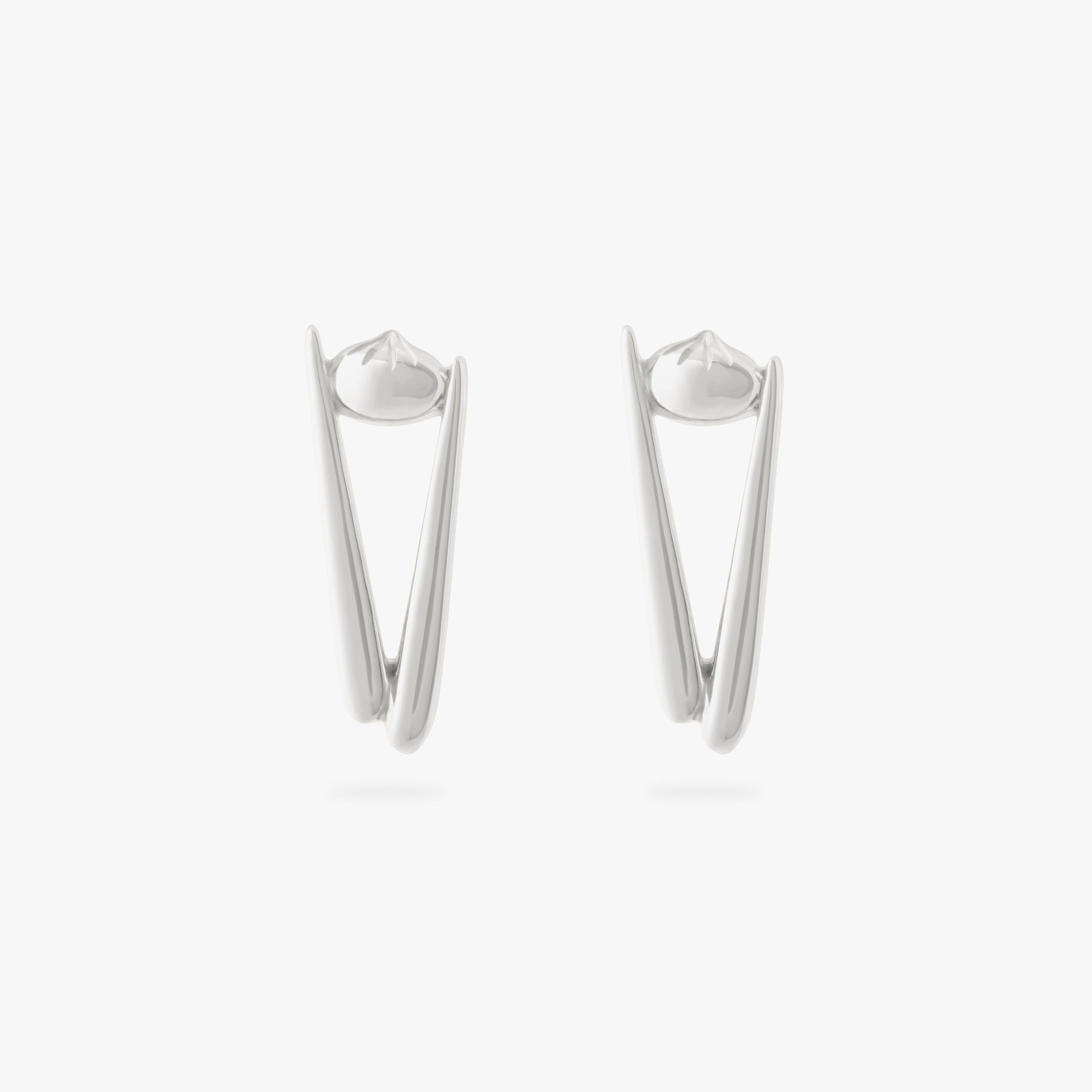 collaboration collection between DTF x Studs featuring a flatback with a pair of chopsticks holding a dumpling in silver color:null|silver