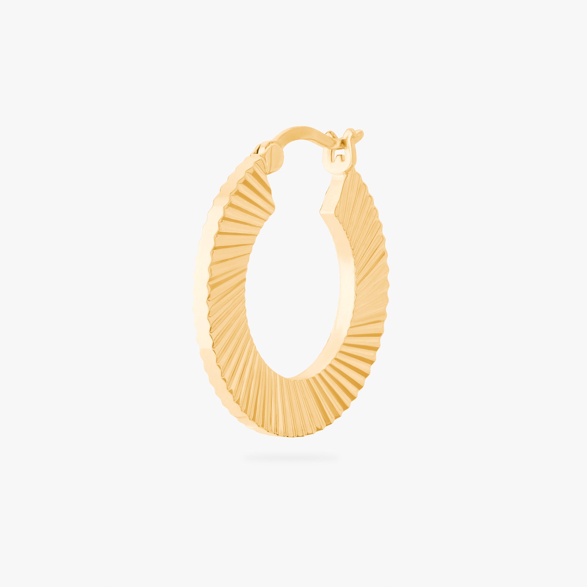 This is an image of a 14K gold plated hoop that has a fluted, shell-like finish. - Main view