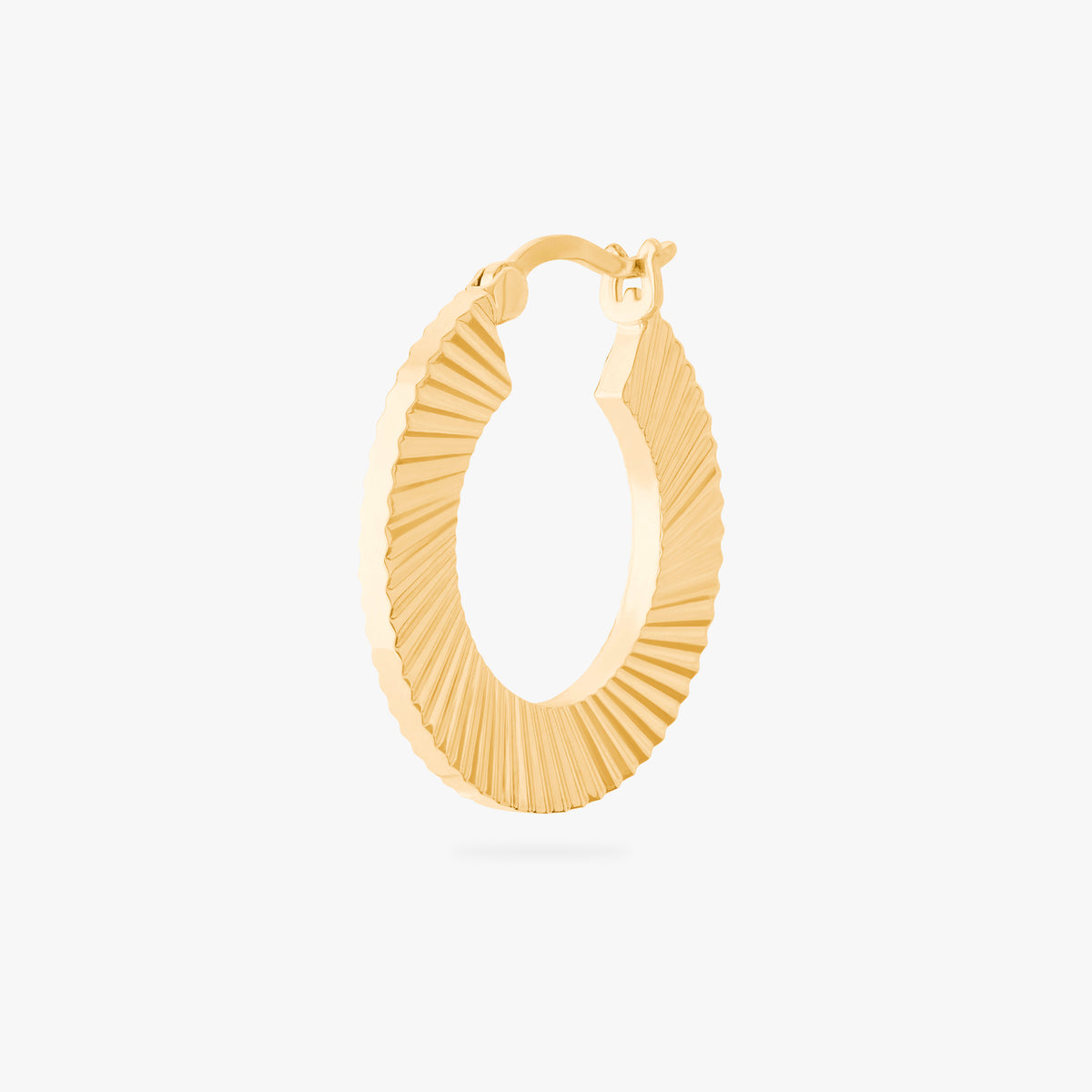 This is an image of a 14K gold plated hoop that has a fluted, shell-like finish. 
