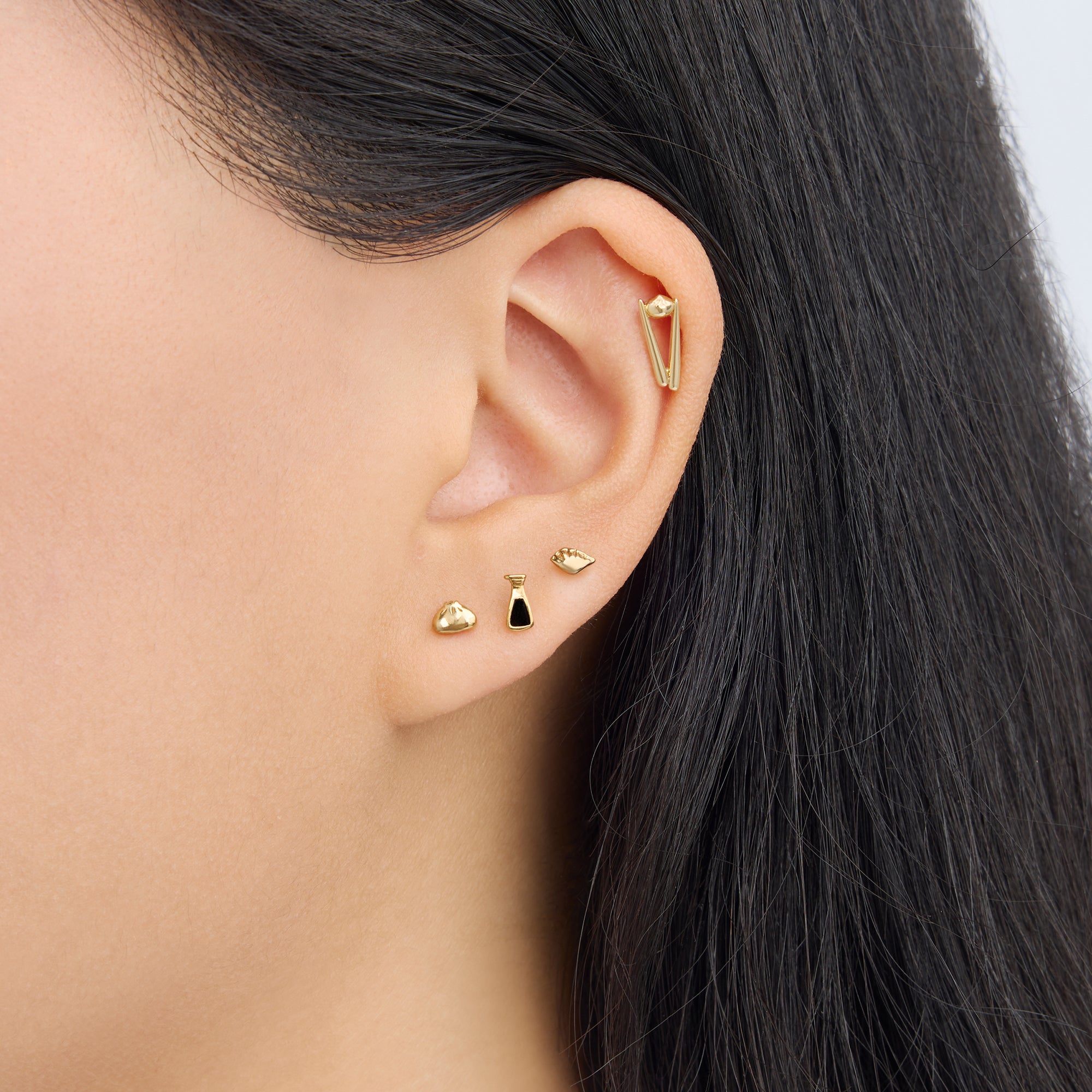 set of flatback earrings from the studs x din tai fung collection in gold [hover] color:null|gold