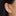 on ear photo with a circled flatback stud that spells NY in gothic font in gold [hover] color:null|gold