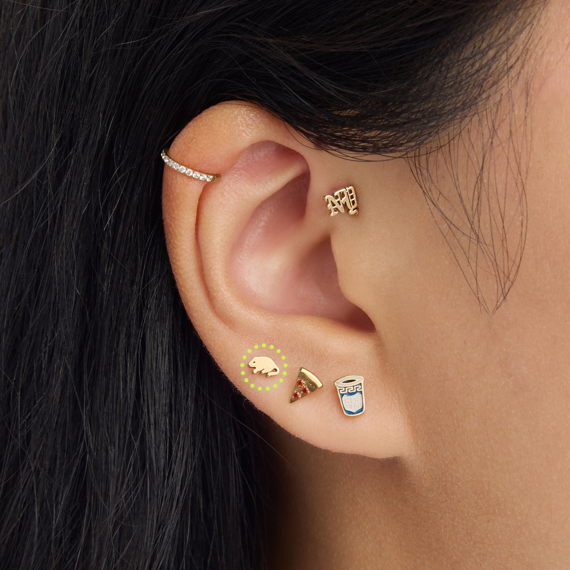 on ear photo of a circled rat shaped flatback stud in gold [hover] color:null|gold