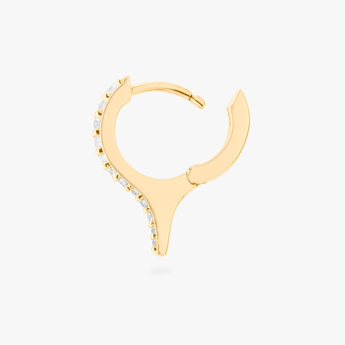 Gold huggie with a spike and small clear stones on a white background, side view with earring open