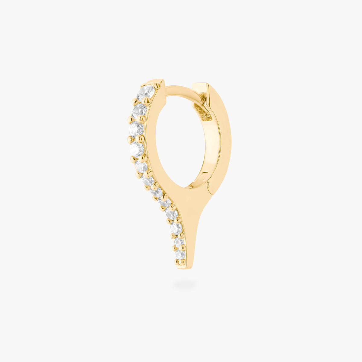 Gold huggie with a spike and small clear stones on a white background