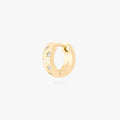 This image displays a 14K gold plated chunky huggie that features twinkle star shaped engravings with crystal CZ stones throughout the huggie against a white background. 