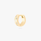 This image displays a 14K gold plated chunky huggie that features twinkle star shaped engravings with crystal CZ stones throughout the huggie against a white background. 