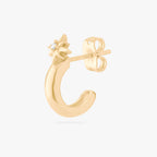 This is an image of a 14K gold plated stud with a twinkle star with a crystal CZ that is shaped like a hoop against a white background.