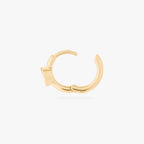 Gold hoop earring side view with clasp open on a white background