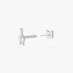 This is an image of a silver toned titanium flatback stud that is shaped like a cat. The top which is shaped like a cat face, is separated from the flatback post which is shaped like the rear end of the kitten. 