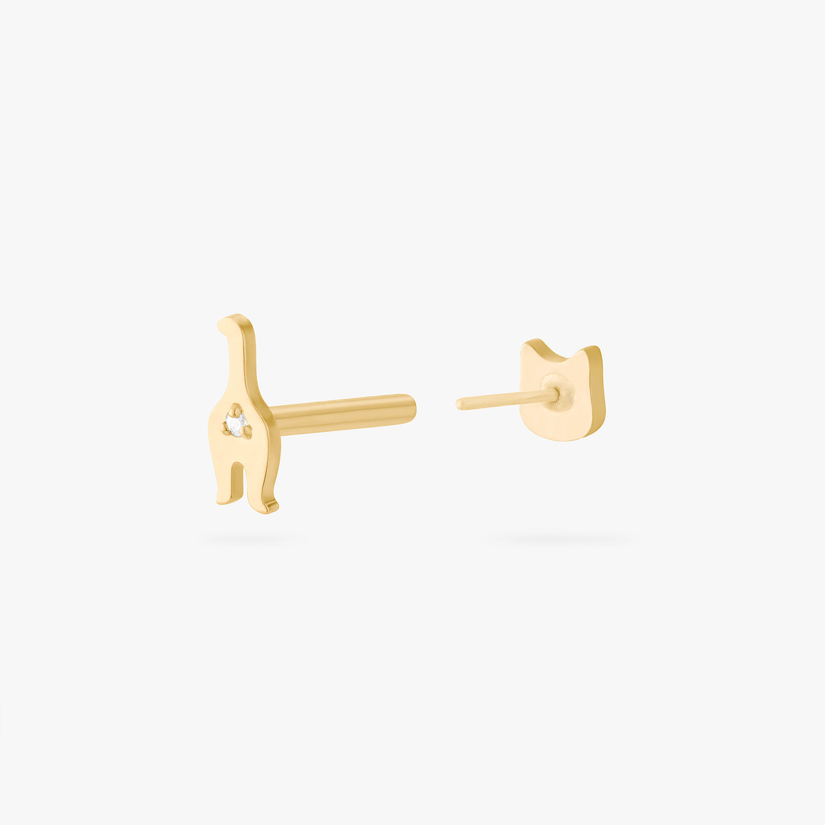 Gold cat-shaped earrings on a white background