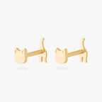 Two gold cat-shaped earrings on a white background