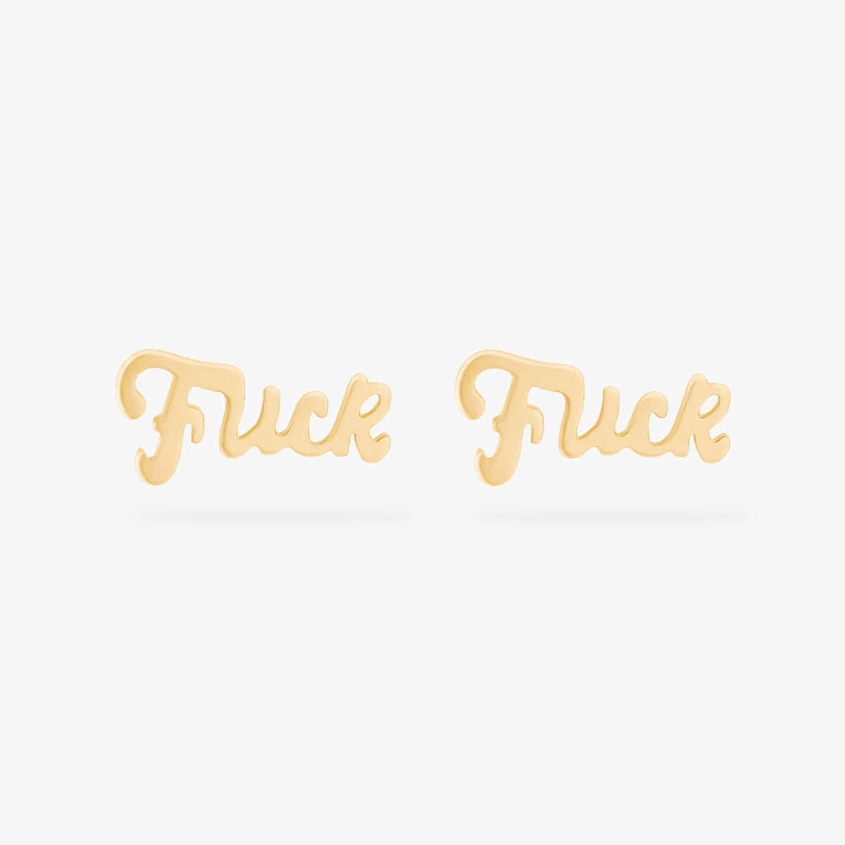 Two gold stud earrings on a white background