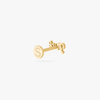 Gold stud earring on a white background