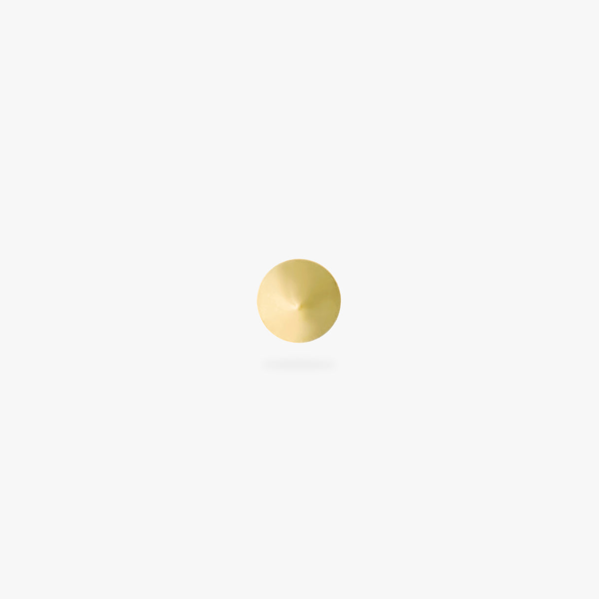 This image is a yellow anodized titanium flatback stud in the shape of a spike against a white background.