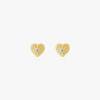 This is an image of a pair of gold-toned titanium flatback studs in the shape of hearts with twinkle shaped stars within them, and crystal CZs within that. 