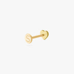This is an image of a gold-toned titanium flatback stud in the shape of a heart with a twinkle shaped star within it, and a crystal CZ within that facing away from the camera to display the Studs "S" on the flatback post.