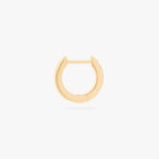 This is an image of a 14K gold plated huggie earring with 6 baguette cut, bezel set crystal CZs along the edge. 