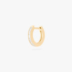 This is an image of a 14K gold plated huggie earring with 6 baguette cut, bezel set crystal CZs along the edge. 