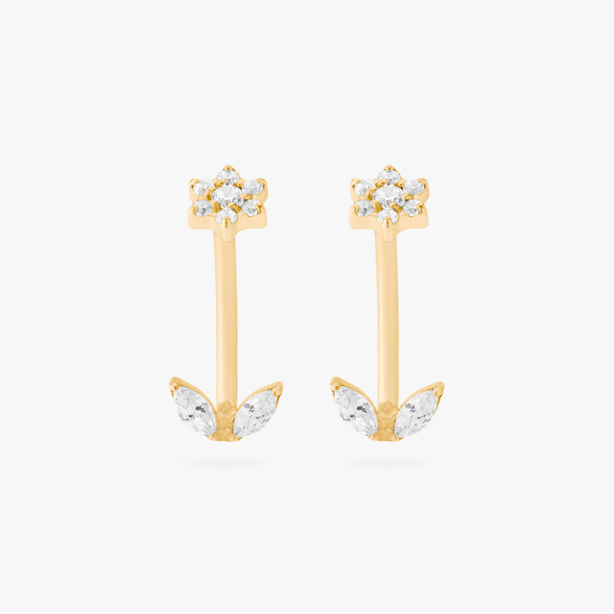 This is an image of a pair of gold-toned titanium curved barbells with crystal CZs in the shape of flowers on one end of each bar, and crystal CZs in the shape of leaves on the other end of each bar. 