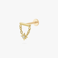 This is an image of a gold toned flatback stud which has a bar with chains from either side supporting a dangling twinkle star with a clear, round CZ center stone. 