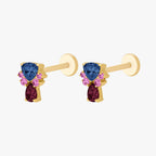 This image show the side view of a pair of  the anodized triangle crown flatbacks. the flatback has a blue cz stone on the top, a pear red cz stone on the bottom and four  pink cz circular stones on each side of the earring. 