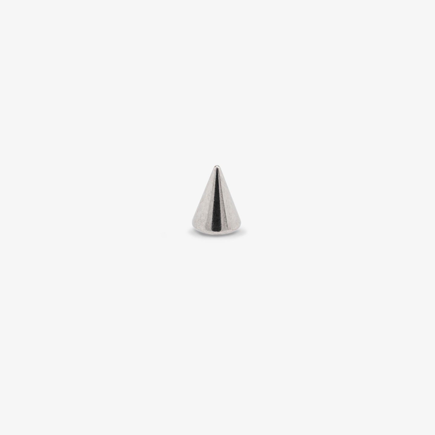 This is a small silver spike stud color:null|silver