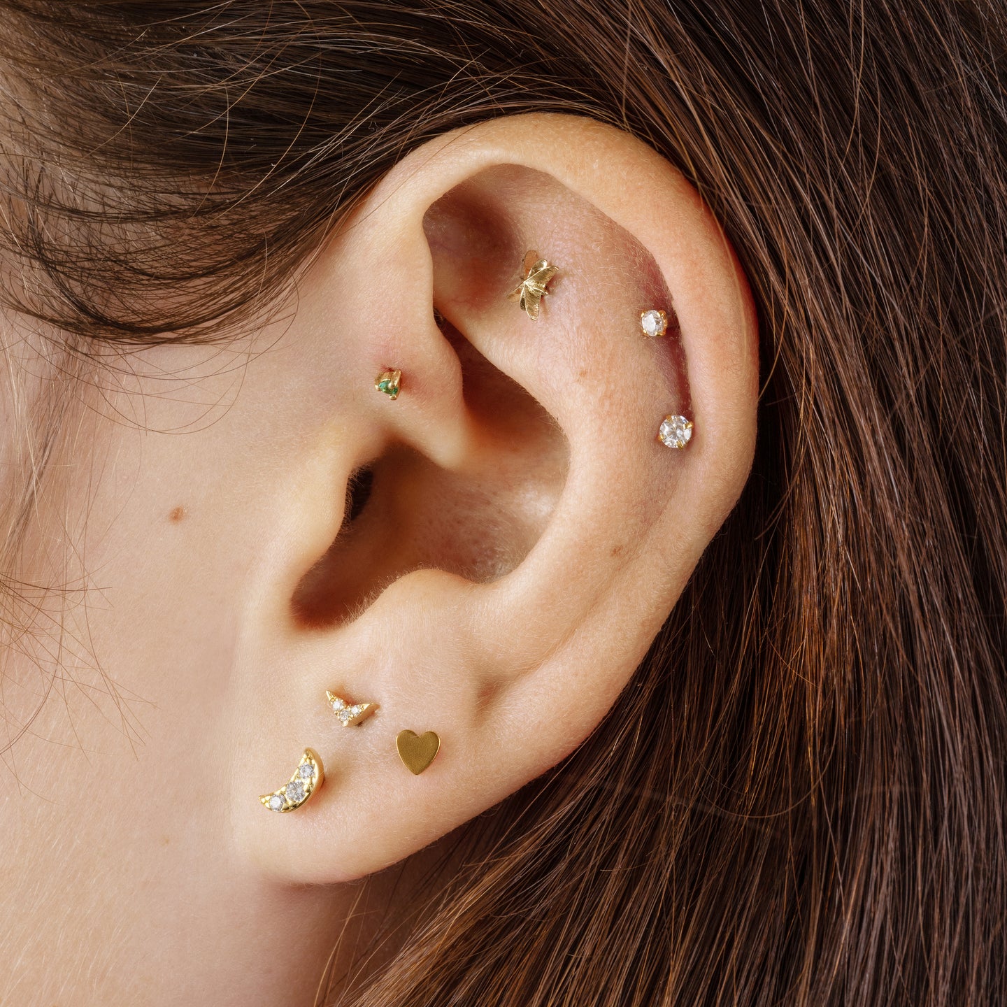 This is a small 14k gold stud with a CZ [hover] color:null|gold/clear