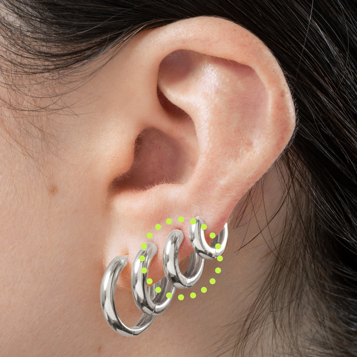 Mini sized chunky silver huggie. color:silver