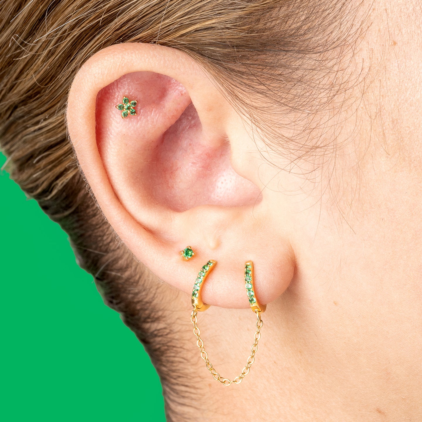 2mm gold and green gem CZ stud. [hover] color:gold/green