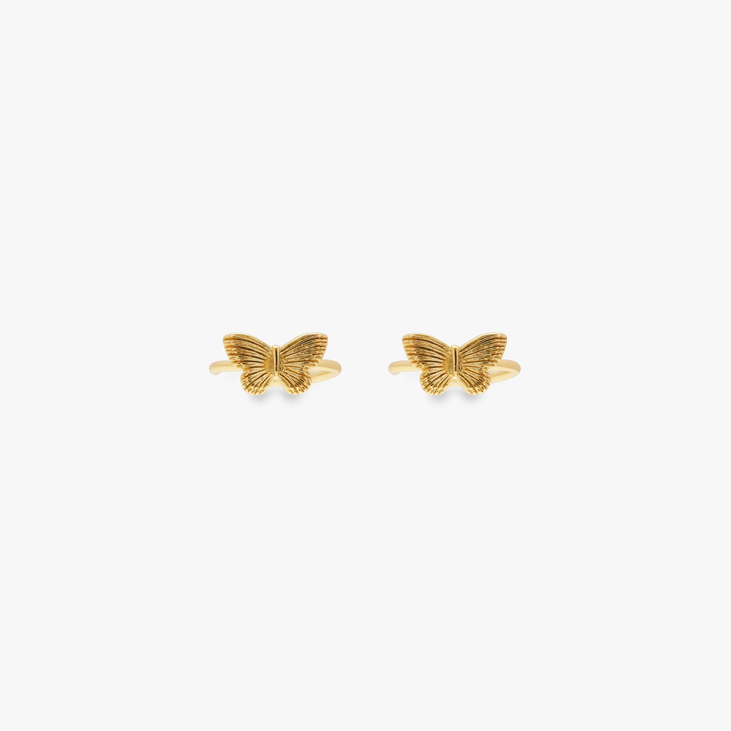 Gold butterfly cuff. [pair] color:null|gold