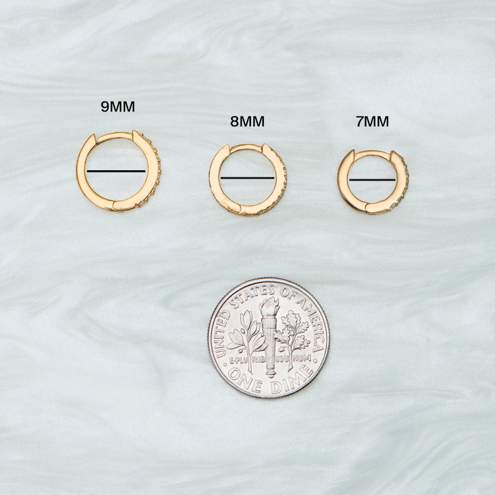 This is a small gold huggie with pavé detailing that measures 8mm [hover] color:null|gold/clear