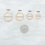 This is a small gold huggie that measures 8mm color:null|gold