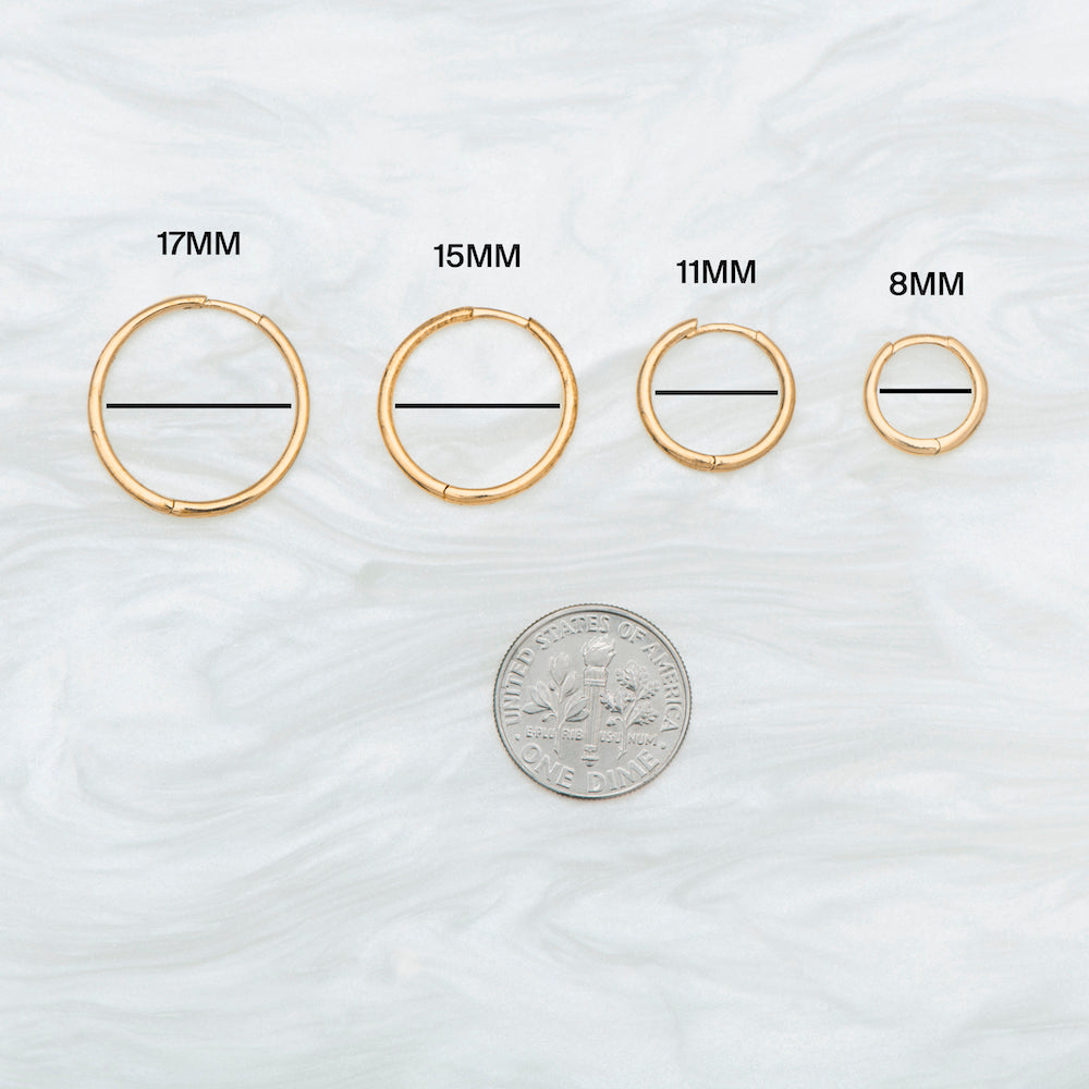 This is a small gold huggie that measures 8mm color:null|gold