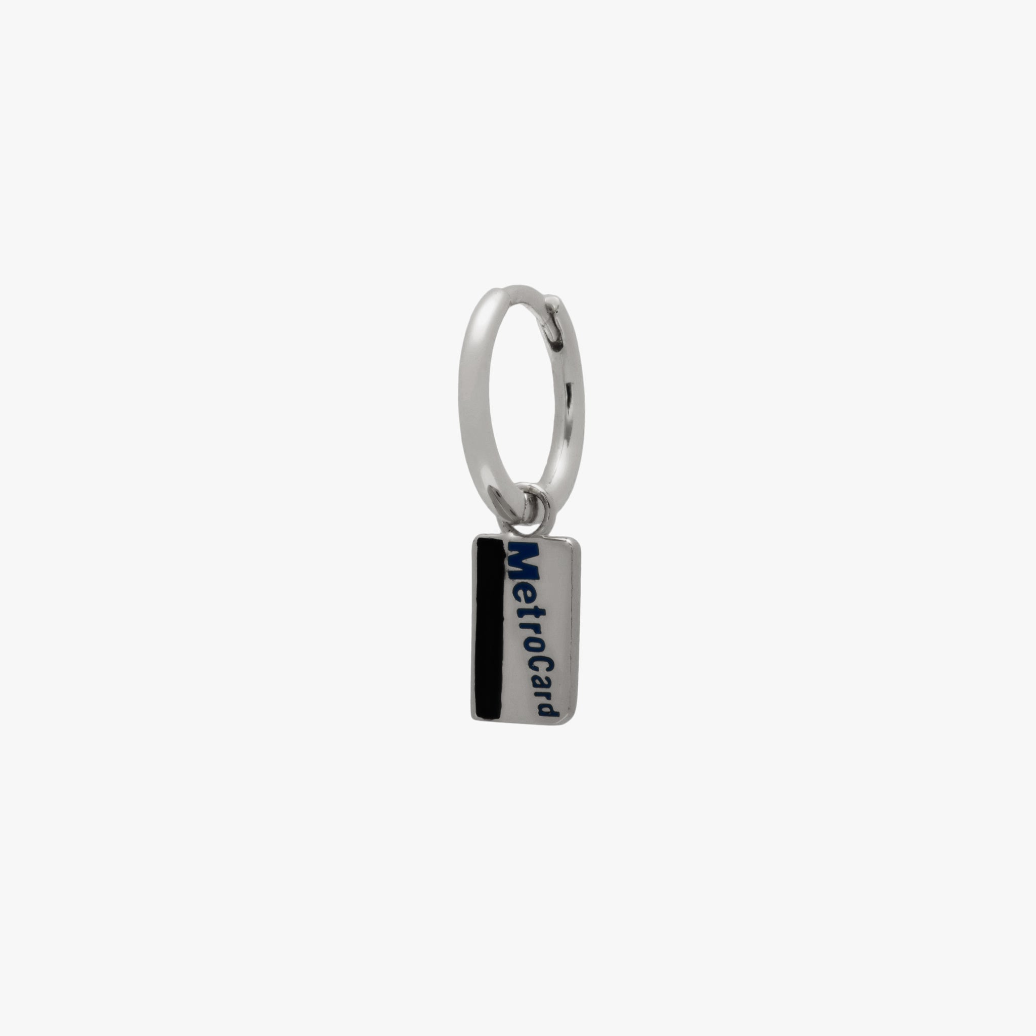 A silver metro card charm huggie color:null|silver