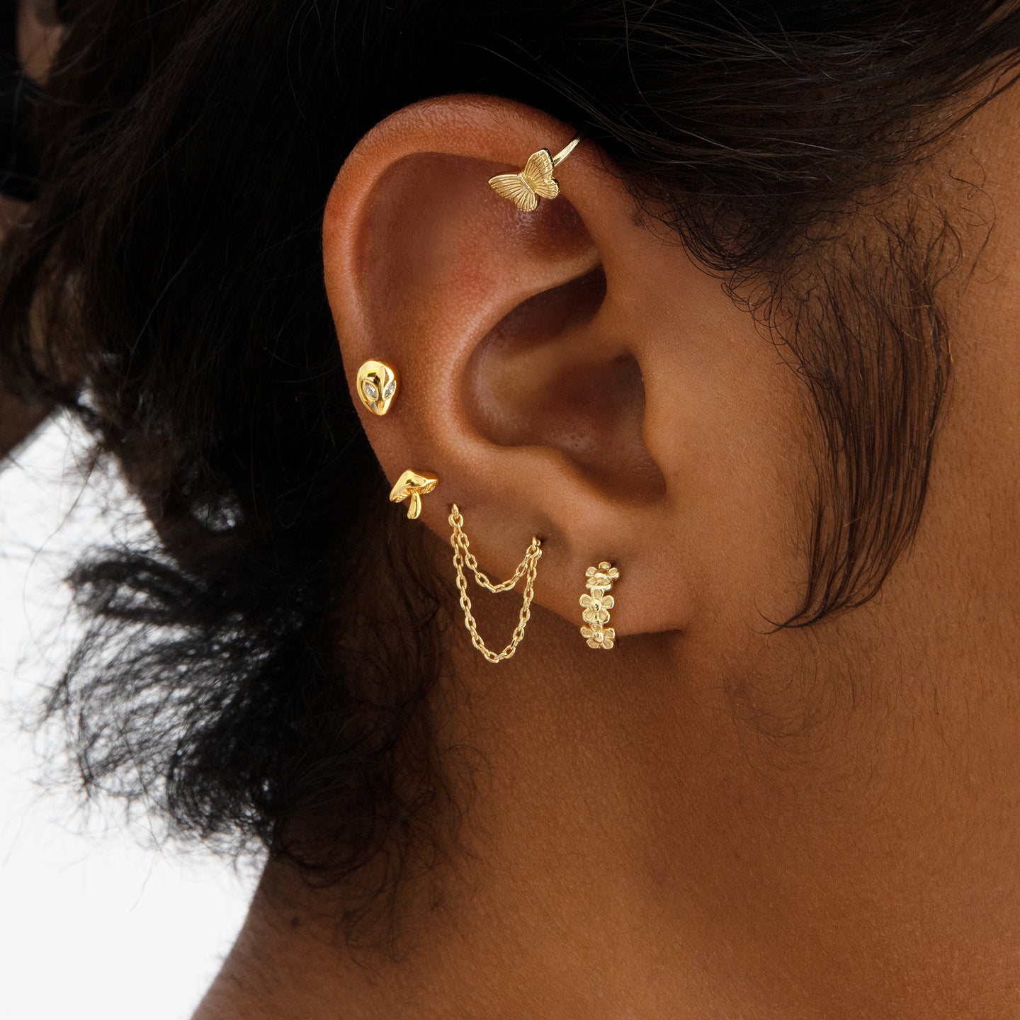 A gold double chain connector earring. [hover] color:null|gold