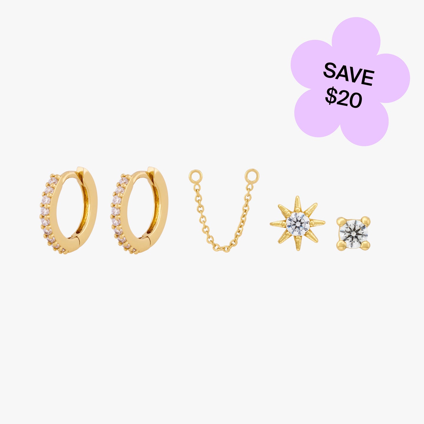 A set containing a pair of gold/clear mini pave huggies, a 30mm gold chain, a gold/clear starburst stud, and a gold/clear mini cz stud color:null|gold