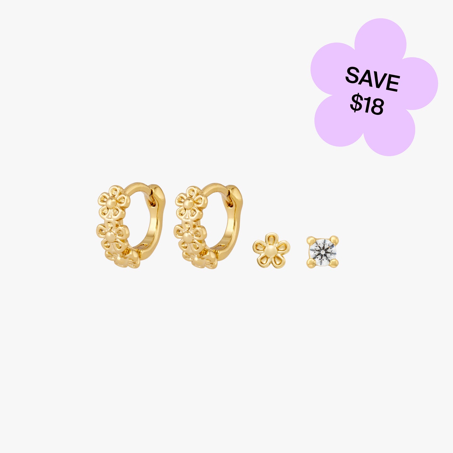 Set with pair of gold daisy huggies, a gold daisy stud, and a gold/clear mini cz stud color:null|gold