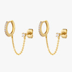 A pair of chained gold huggies with cubic zirconia and gold stud with cubic zirconia. 