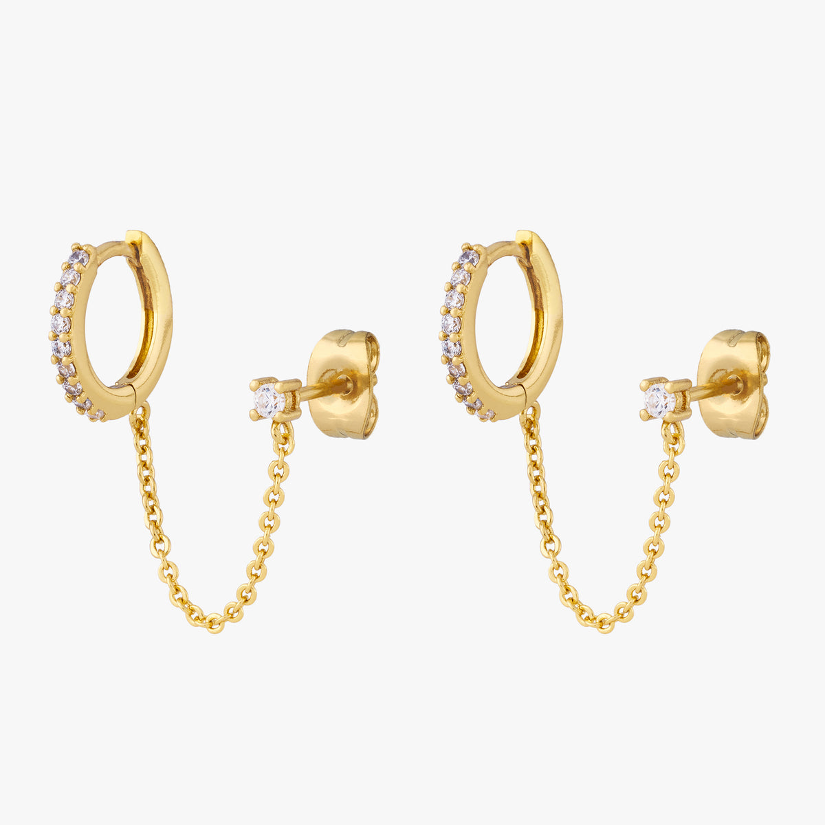 A pair of chained gold huggies with cubic zirconia and gold stud with cubic zirconia. 