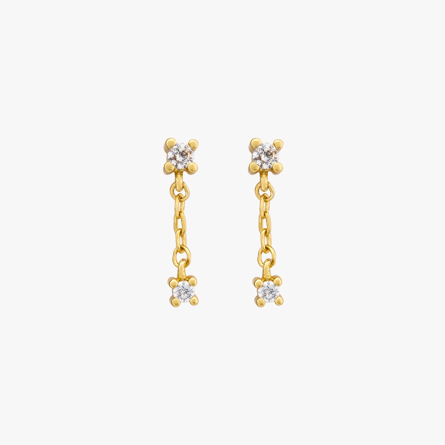 This is a pair of small cz studs with a dangling cz connected by a gold chain [pair] color:null|gold/clear