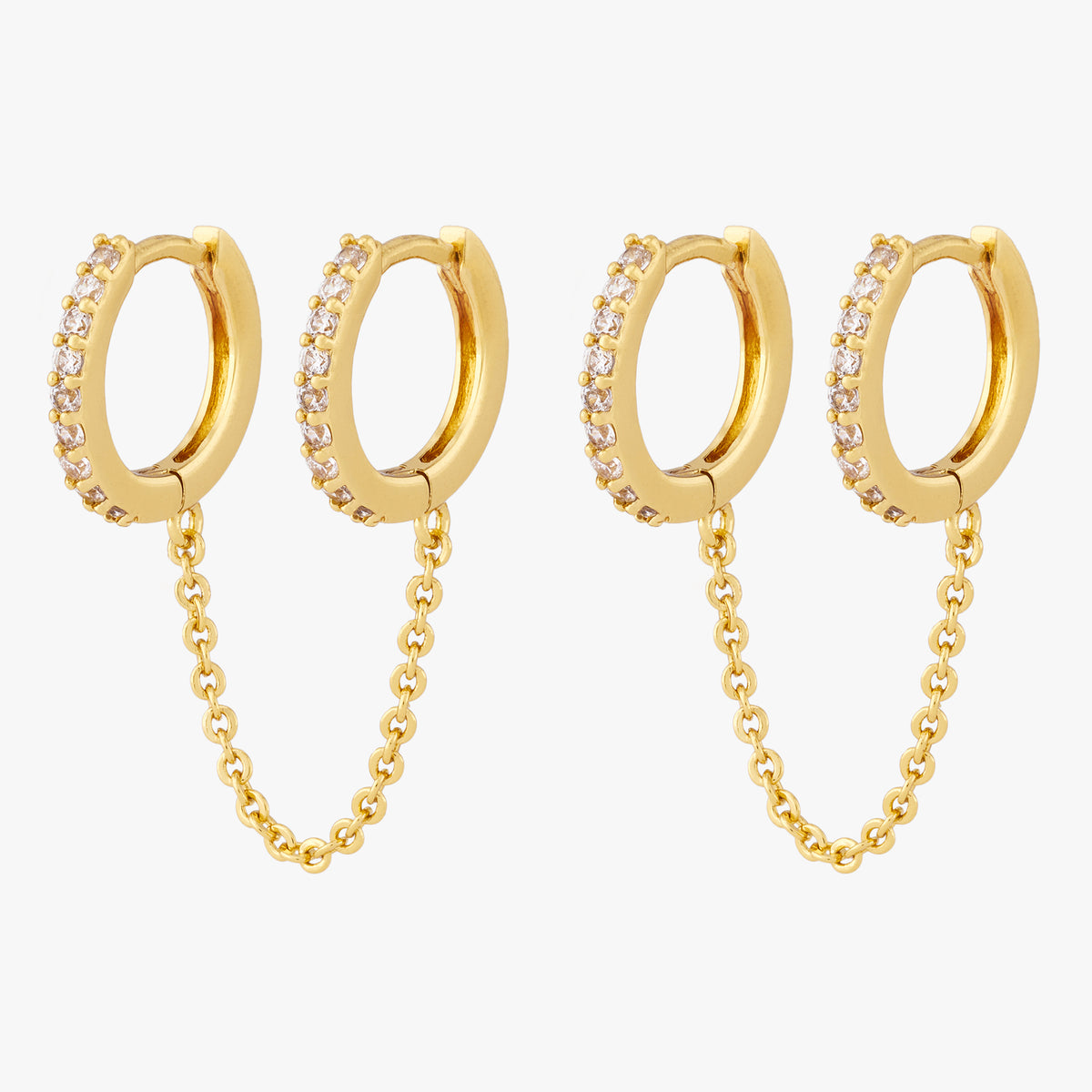 A pair of two separate CZ front huggies attached by a gold chain 