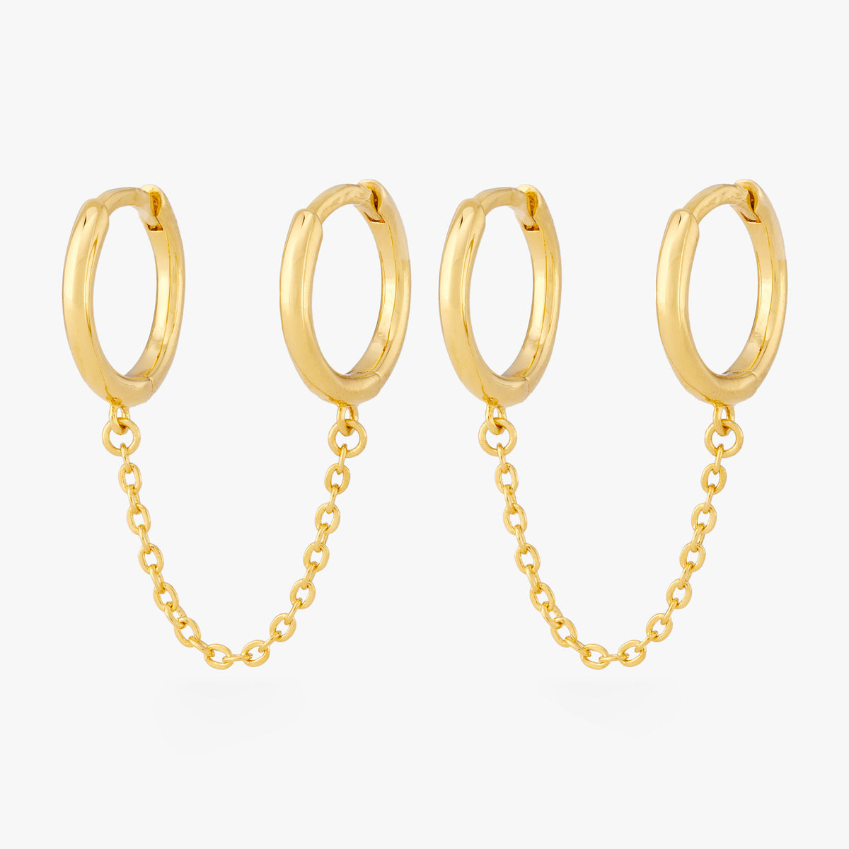 A pair of two separate hoop earrings connected by a chain. [pair] color:null|gold