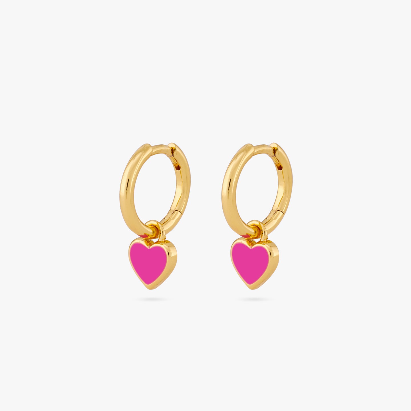 A pair of gold huggies with a pink enamel heart shaped charm [pair] color:null|gold